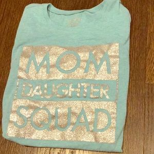 A long sleeve t-shirt with a glittery title
